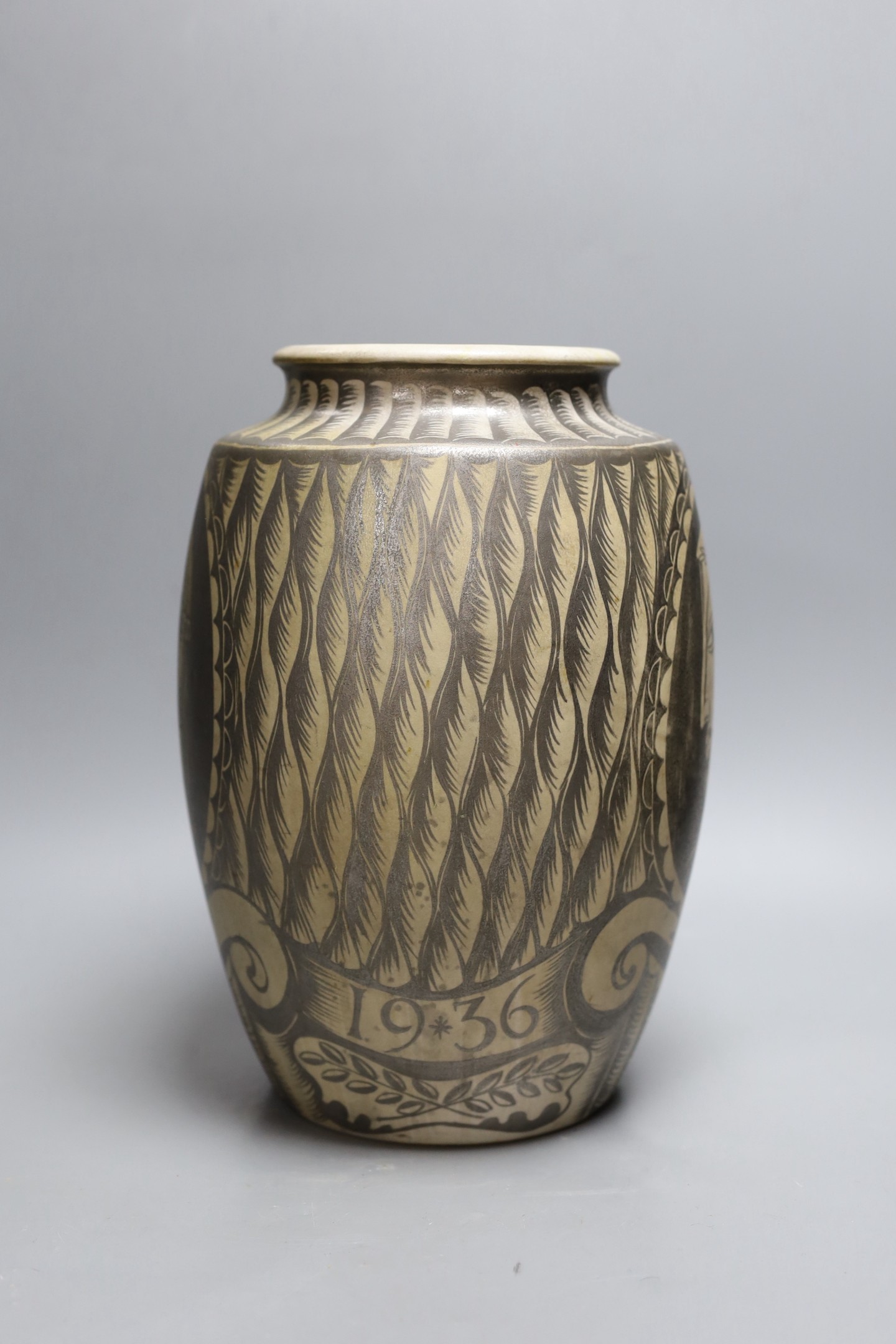 A possibly unique Royal Doulton Lambeth stoneware silver lustre vase, c.1936, painted with Greek style heads on a feather ground, inscribed ‘A*E*B 1936’, impressed marks to base, 30.5 cm high